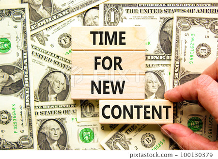 Time for new content symbol. Concept words Time for new content on wooden blocks. Beautiful background from dollar bills. Businessman hand. Business time for new content concept. Copy space. Time for new content symbol. Concept words Time for new content on wooden blocks. Beautiful background from dollar bills. Businessman hand. Business time for new content concept. Copy space. 100130379