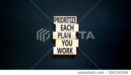 Prioritize each plan you work symbol. Concept words Prioritize each plan you work on wooden blocks on beautiful black table black background. Business prioritize each plan you work concept. Copy space Prioritize each plan you work symbol. Concept words Prioritize each plan you work on wooden blocks on beautiful black table black background. Business prioritize each plan you work concept. Copy space 100130396