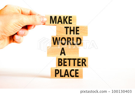 Make a better world symbol. Concept words Make the world a better place on wooden blocks. Beautiful white table white background. Businessman hand. Business make a better world concept. Copy space. Make a better world symbol. Concept words Make the world a better place on wooden blocks. Beautiful white table white background. Businessman hand. Business make a better world concept. Copy space. 100130403