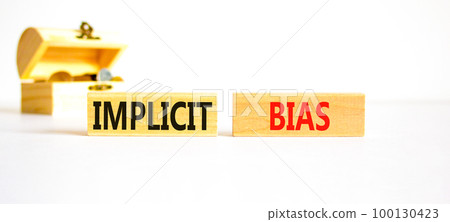Implicit bias symbol. Concept words Implicit bias on wooden block. Beautiful white table white background. Beautiful wooden chest with coins. Business psychology implicit bias concept. Copy space. Implicit bias symbol. Concept words Implicit bias on wooden block. Beautiful white table white background. Beautiful wooden chest with coins. Business psychology implicit bias concept. Copy space. 100130423