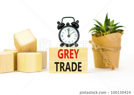Grey trade symbol. Concept words Grey trade on wooden block. Beautiful white table white background. Black alarm clock. Green house plant. Business grey trade concept. Copy space. Grey trade symbol. Concept words Grey trade on wooden block. Beautiful white table white background. Black alarm clock. Green house plant. Business grey trade concept. Copy space. 100130424