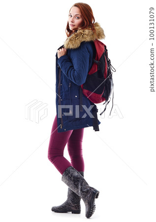 Keeping warm and stylish. Studio portrait of a young woman in winter wear and carrying a backpack against a white background. 100131079