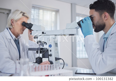 Research, microscope and science people teamwork, medical analysis and exam in laboratory. Biotechnology, pharmaceutical medicine and scientist internship or student with professional senior doctor 100131382