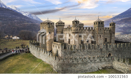 one of the most beautiful and famous medieval castles of Italy Castello di Fenis in Valle d'Aosta , aerial drone view 100131563