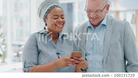 Executive black woman, senior man and phone in office for happiness, comic meme or conversation. African woman, boss and funny video on social media, internet or app while on break at startup company 100131720
