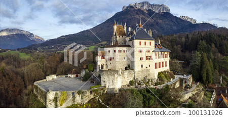 Most beautiful medieval castles of France - fairytale Menthon located near lake Annecy. aerial view 100131926