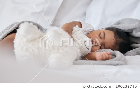 Sleeping, teddy bear and relax with baby in bedroom for cute, comfortable and dreaming. Innocence, young and rest with tired child at home for and napping with toy for bedtime, youth and sweet 100132789