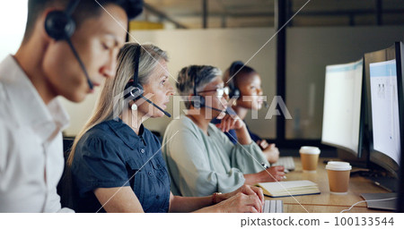 Senior call center consultant, woman and contact us, CRM and talking in customer service, computer at desk. Phone call, telemarketing and diversity, writing in notebook in coworking space and headset 100133544