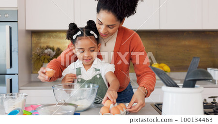 Mother, child and baking with eggs in the kitchen for family bonding, learning and fun with ingredients at home. Happy mom teaching helpful kid to bake, cook or mix for recipe together at the house Mother, child and baking with eggs in the kitchen for family bonding, learning and fun with ingredients at home. Happy mom teaching helpful kid to bake, cook or mix for recipe together at the house 100134463