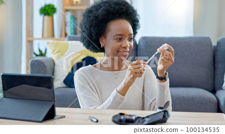 Woman with syringe preparing an insulin injection at home with an online tutorial. One girl injecting self with medicine treatment to treat chronic illnesses type 1 2 diabetes, high blood or glycemia Woman with syringe preparing an insulin injection at home with an online tutorial. One girl injecting self with medicine treatment to treat chronic illnesses type 1 2 diabetes, high blood or glycemia 100134535