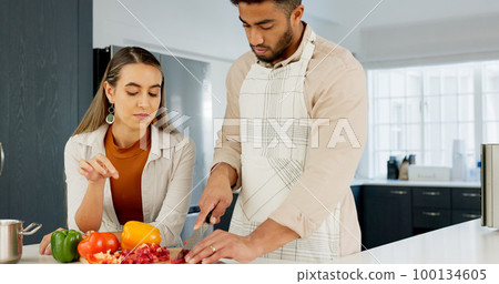 Couple, cooking and together in kitchen and learning for relationship growth and bonding, skill development and support. Young man, woman and cook Italian food, help and advice, spending quality time 100134605