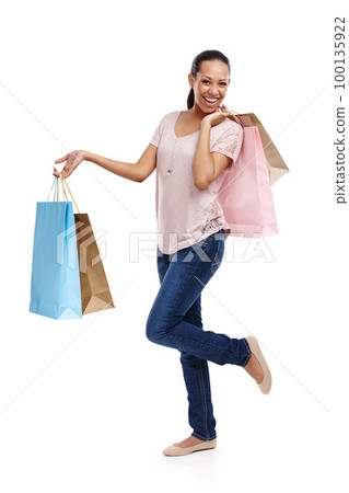 Studio, fashion and portrait of woman with shopping bags isolated on a white background. Black Friday discount, sales deals and happy female customer holding gifts after buying at mall, store or shop Studio, fashion and portrait of woman with shopping bags isolated on a white background. Black Friday discount, sales deals and happy female customer holding gifts after buying at mall, store or shop 100135922
