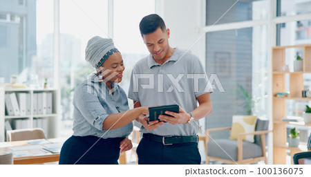 Collaboration, teamwork and business people on tablet in office while working on project. Planning, tech and male employee helping female with marketing research on digital touchscreen in workplace. 100136075