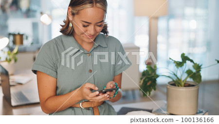 Phone, social media and communication with a business asian woman typing a text message at work. Contact, mobile and search with a female employee sending a reply while texting in the office Phone, social media and communication with a business asian woman typing a text message at work. Contact, mobile and search with a female employee sending a reply while texting in the office 100136166
