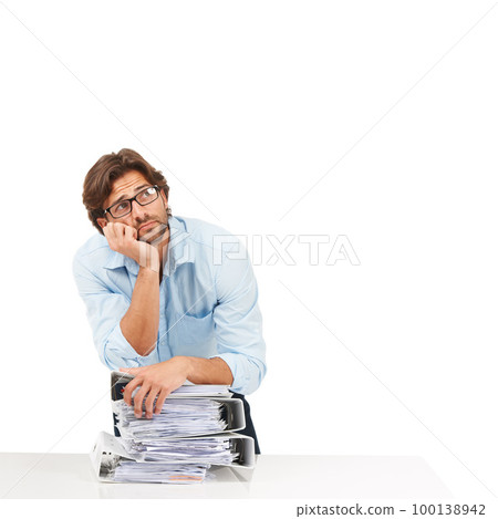 Burnout, stress and businessman with stack of paperwork on desk for deadline, corporate project and report. Ideas, vision and tired employee thinking with pile of files, papers and documents on desk 100138942