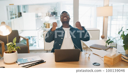 Success, laptop and winner with business black man in office for deal, growth or stock market target. Wow, goals and good news with fist of employee for achievement, future or sale on trading idea 100139046