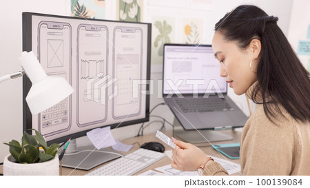 Woman, developer and wireframes with technology in design, planning or strategy at the office. Creative female designer working with layouts by computer for app development or project plan at work 100139084