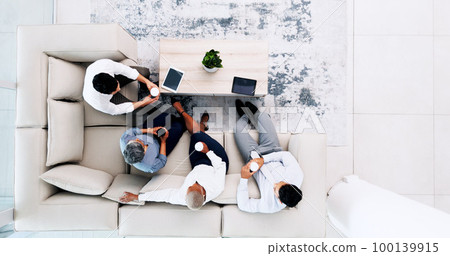 Business meeting, coffee and sofa for planning, b2b collaboration and brainstorming ideas above. Lobby, lounge and technology of corporate worker in teamwork, partnership and workspace coffee break 100139915