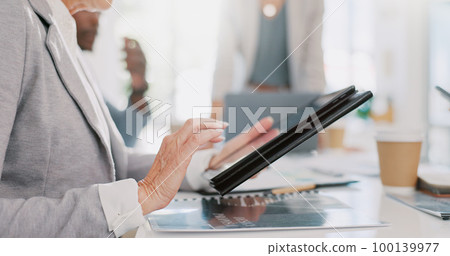 Hands, tablet and senior woman in meeting researching, internet browsing or networking. Technology, planning or elderly female employee typing on touchscreen with business people in company workplace Hands, tablet and senior woman in meeting researching, internet browsing or networking. Technology, planning or elderly female employee typing on touchscreen with business people in company workplace 100139977