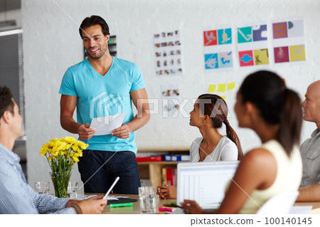 Heres that document you requested. A group of businesspeople discussing work. Heres that document you requested. A group of businesspeople discussing work. 100140145