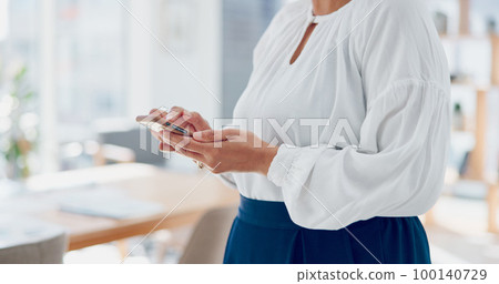 Business, woman and phone typing in office while reading funny notification, online news or text message, social networking and connection. Mature female manager, mobile app and smartphone technology 100140729