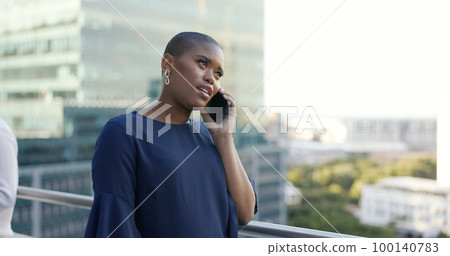 Phone call, communication and black woman at a meeting with a phone for networking, discussion and planning on a balcony. Talking, smile and employee with a mobile conversation during a work strategy Phone call, communication and black woman at a meeting with a phone for networking, discussion and planning on a balcony. Talking, smile and employee with a mobile conversation during a work strategy 100140783