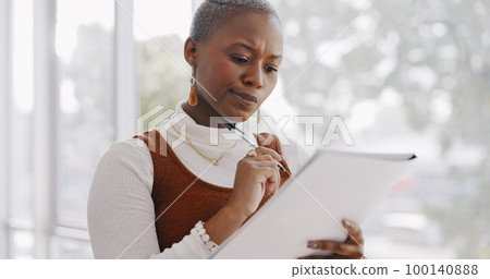 Business, thinking and black woman writing on documents working on report, project and proposal. Vision, ideas and busy female worker with paperwork in office brainstorming, planning and strategy 100140888