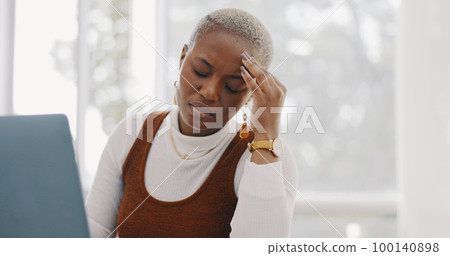 Burnout, stress and professional black woman on a laptop working on project with a deadline. Overworked, frustration and African business employee with a headache doing research on computer in office 100140898