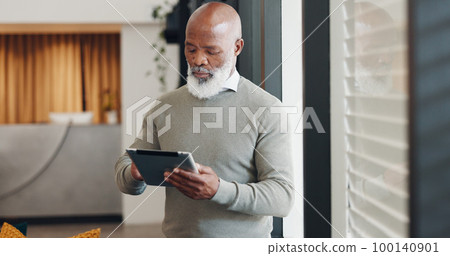 African businessman, tablet and thinking by window with communication, email or research on internet. Senior black man, strategy and innovation on web, app or schedule planning on calendar in Miami 100140901