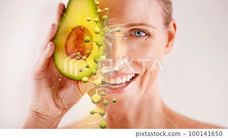 Face, skincare and senior woman with avocado in studio isolated on a gray background. Portrait, cosmetics overlay and happy female model with fruit for nutrition, vitamin c or healthy diet for beauty Face, skincare and senior woman with avocado in studio isolated on a gray background. Portrait, cosmetics overlay and happy female model with fruit for nutrition, vitamin c or healthy diet for beauty 100141650