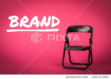 BRAND, business concept. Black chair on a pink background BRAND, business concept. Black chair on a pink background 100141968