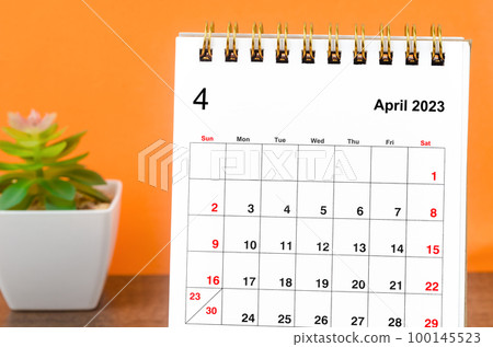 Close up the April 2023 Monthly desk calendar on wooden table. Close up the April 2023 Monthly desk calendar on wooden table. 100145523