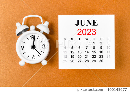 The June 2023 Monthly calendar for the organizer to plan 2023 year with white alarm clock on yellow background. The June 2023 Monthly calendar for the organizer to plan 2023 year with white alarm clock on yellow background. 100145677
