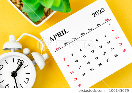 The April 2023 Monthly calendar for 2023 year with alarm clock on yellow background. The April 2023 Monthly calendar for 2023 year with alarm clock on yellow background. 100145679