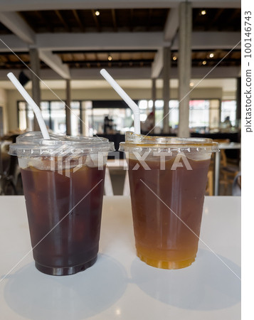 Iced americano with orange and iced americano in coffee shop Iced americano with orange and iced americano in coffee shop 100146743