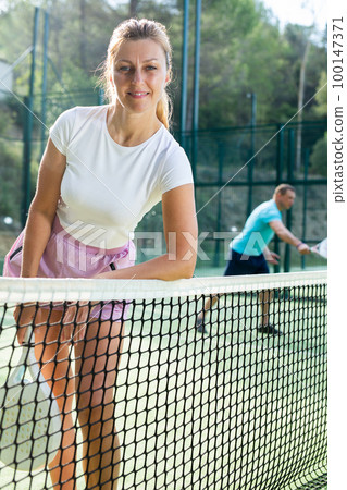 Portrait of a European woman padel tennis player Portrait of a European woman padel tennis player 100147371