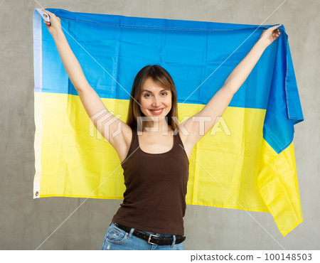 Positive girl with Ukraine flag rooting for your favorite team Positive girl with Ukraine flag rooting for your favorite team 100148503