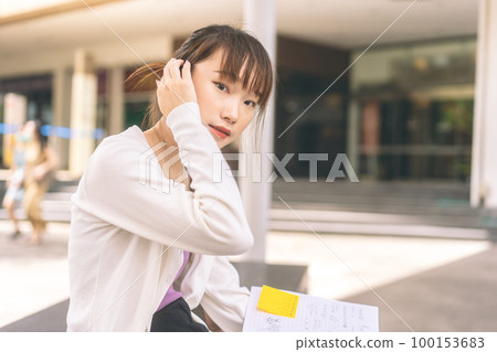 Portrait of young adult asian student woman at outdoor on day 100153683