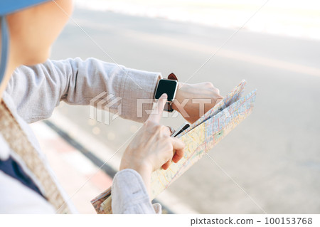 Close up hand woman people wear smart watch checking notifications on device screen at outdoor Close up hand woman people wear smart watch checking notifications on device screen at outdoor 100153768