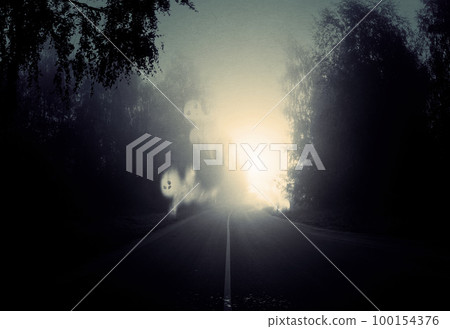 Night foggy forest road and ghosts Night foggy forest road and ghosts 100154376
