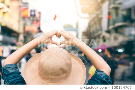 Asian traveller woman person hand with heart gesture. 100154705