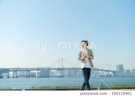 A businessman with a smartphone 100158461