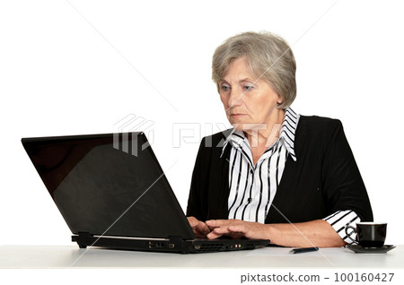 old woman working with laptop on white background old woman working with laptop on white background 100160427