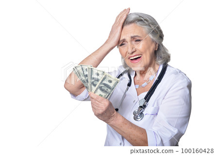 Portrait of female doctor holding money bills 100160428
