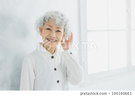 A woman with gray hair A woman with gray hair 100160661