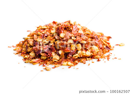 Dry chili pepper flakes. Crushed red peppers isolated on white background. 100162507
