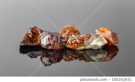 Group of Stones and Minerals on Reflective Surface Group of Stones and Minerals on Reflective Surface 100162631