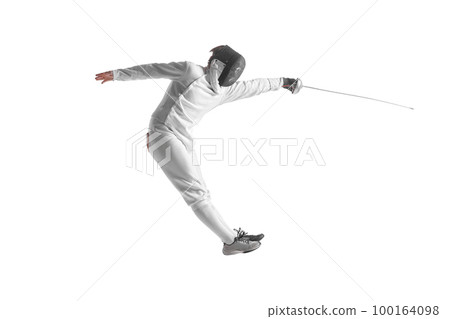 Professional male fencer in fencing costume training with sword isolated on white studio background. Concept of sport, competition, professional skills, achievements 100164098