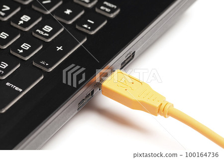 laptop with USB orange cable laptop with USB orange cable 100164736