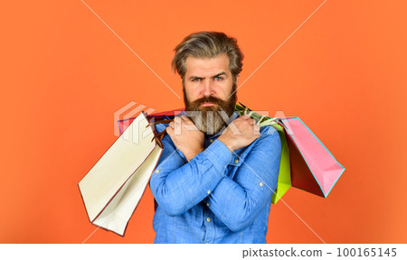 Boost sales. Hipster buying sale price. Black Friday. Cyber monday sale. Profitable deals. Retail concept. Happy holidays. Handsome buyer. Free shipping. Bearded man hold shopping bags. Seasonal sale 100165145